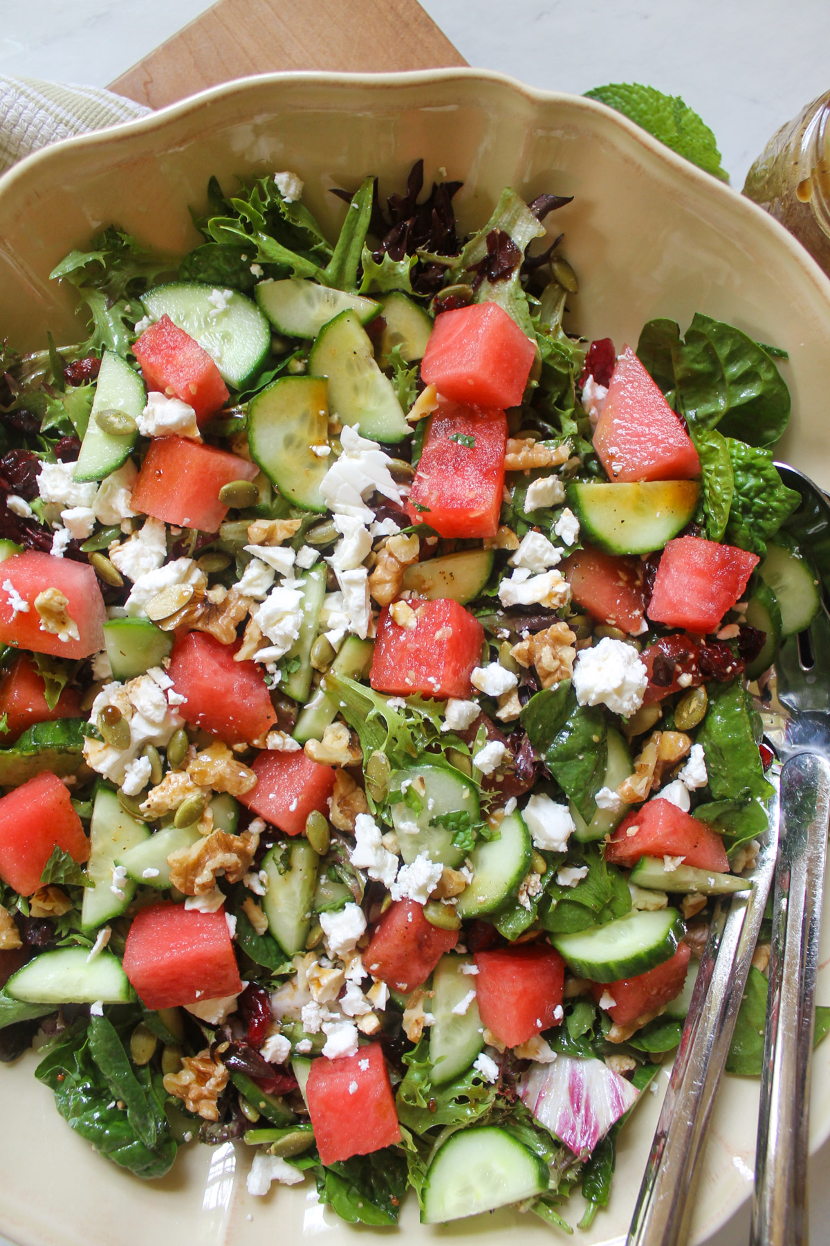 Salad with watermelon cubes, sliced cucumber, feta cheese and fresh mint.