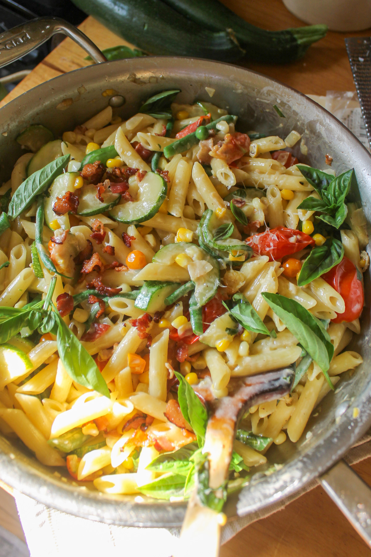 A skillet of creamy garden vegetable pasta.