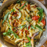 Garden vegetable harvest pasta with bacon crumbles.