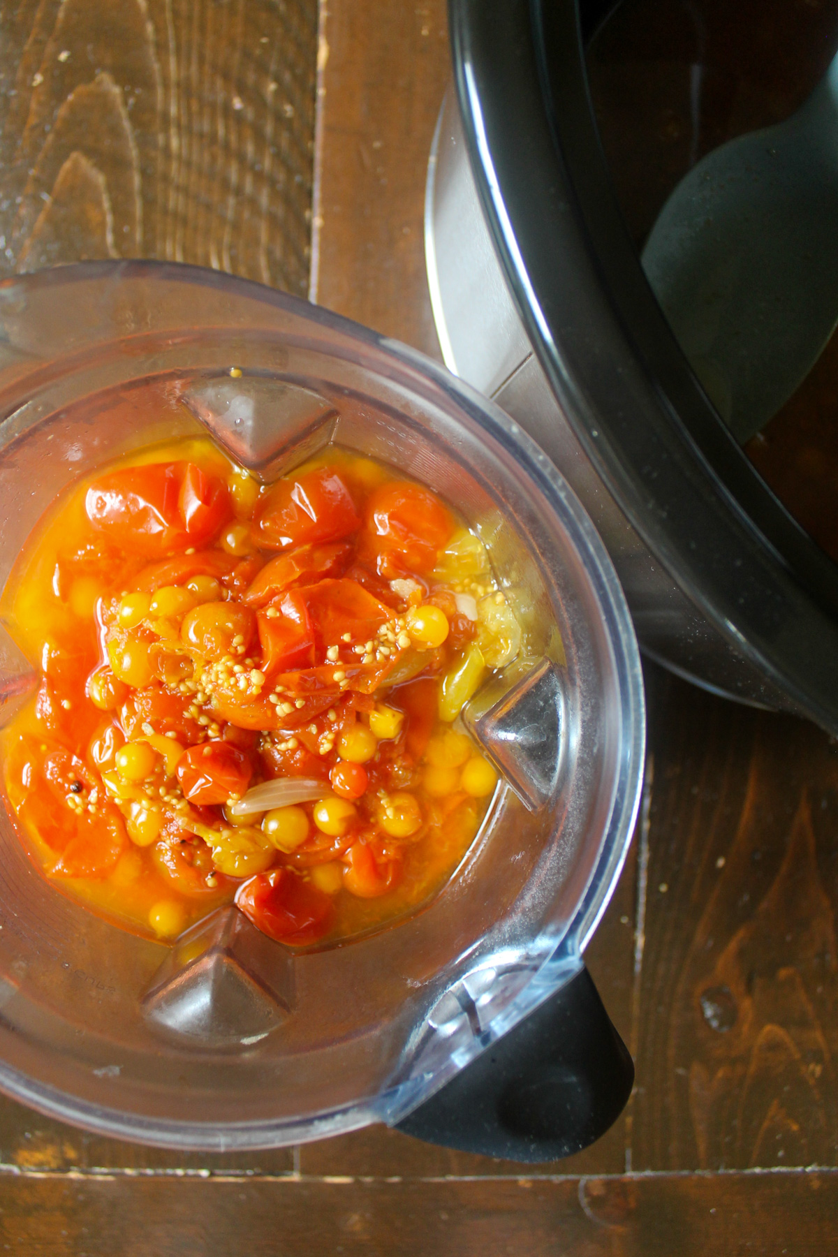 Cooked tomatoes in a blender.