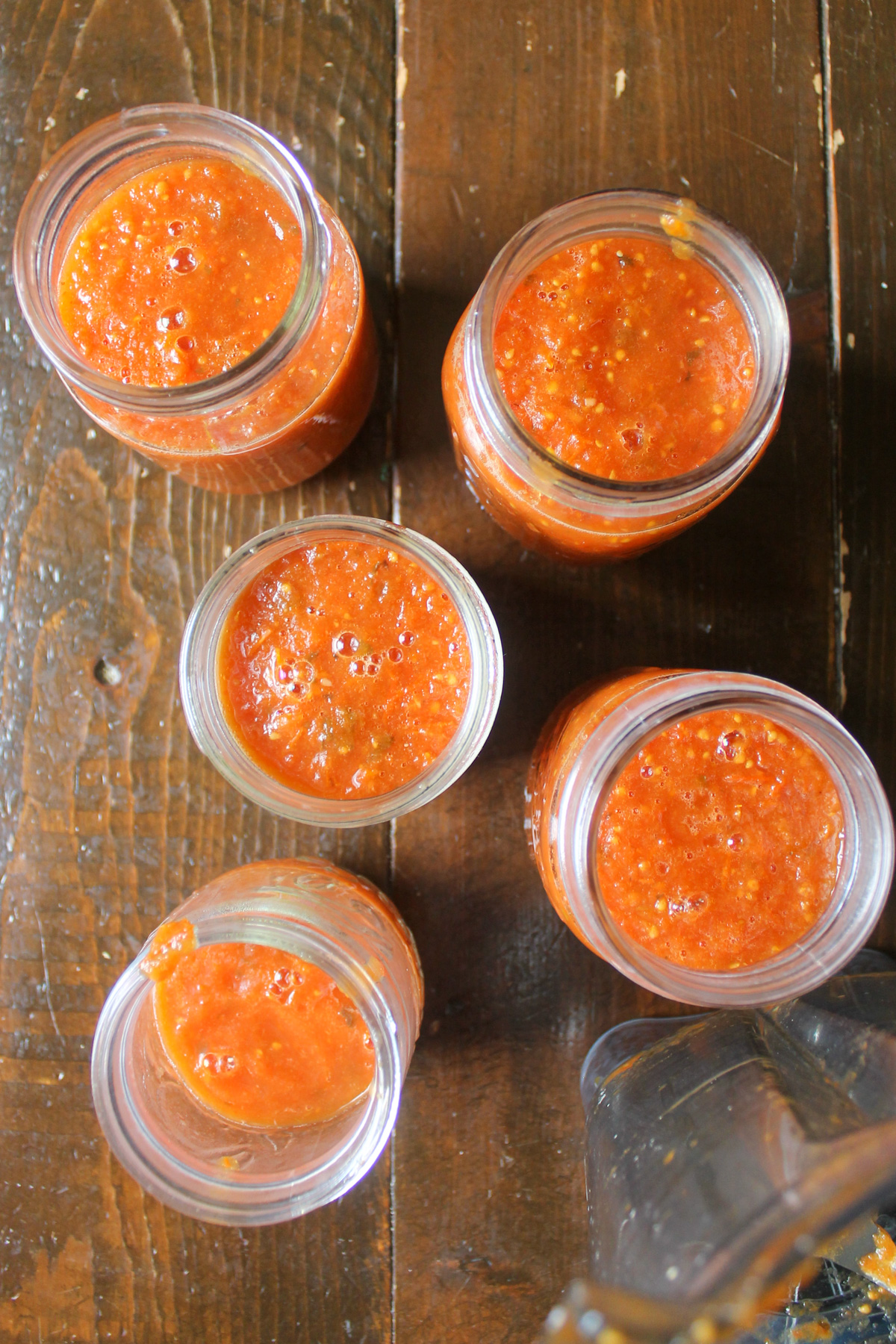 Five jars of garden tomato sauce for the freezer.
