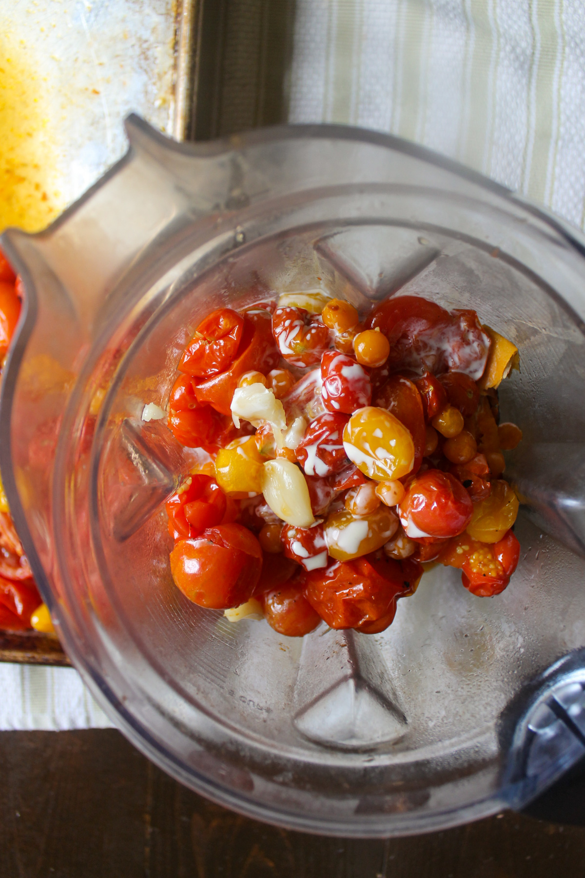Roasted sweet potato and tomatoes in a blender.