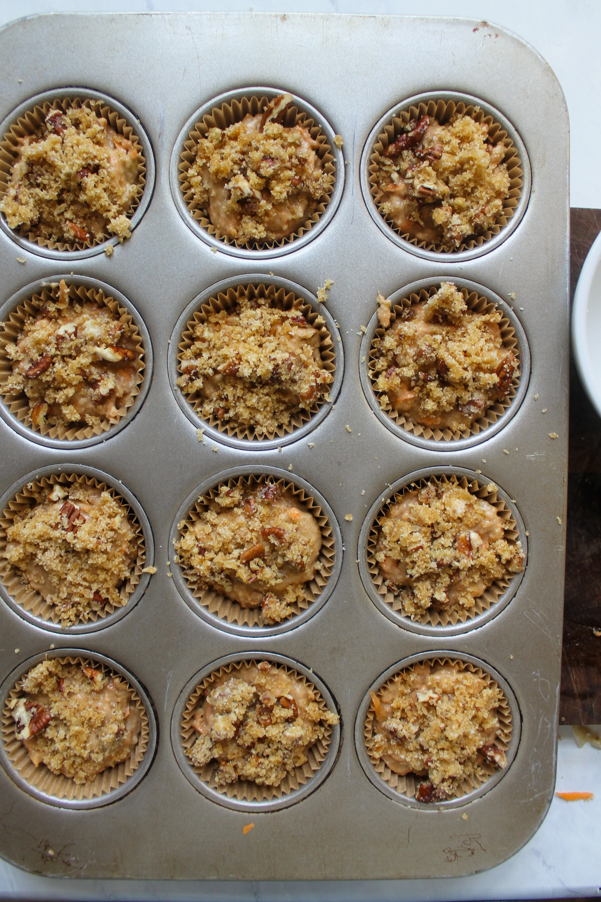 A muffin tin filled with batter.